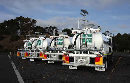 A fleet of 8,000-litre CivMaster FSR hydraulic water trucks built for Tutt Bryant, parked in an open-air car park in Geelong, Victoria.