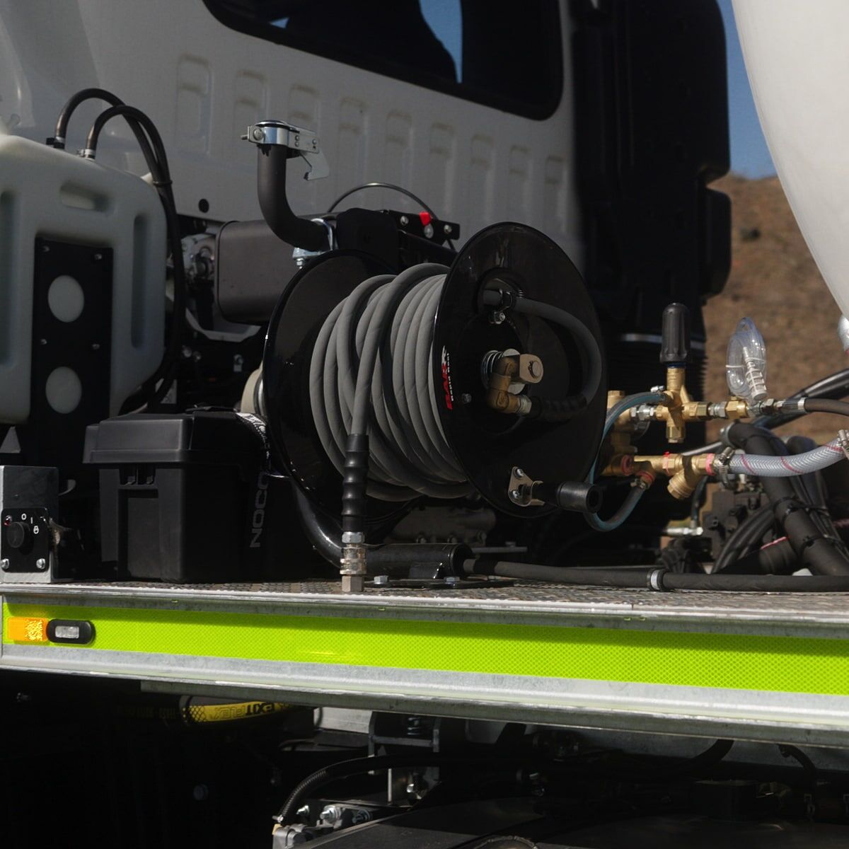 A Yanmar L48 diesel-powered pressure washer mounted on an FVZ water truck by National Water Carts.